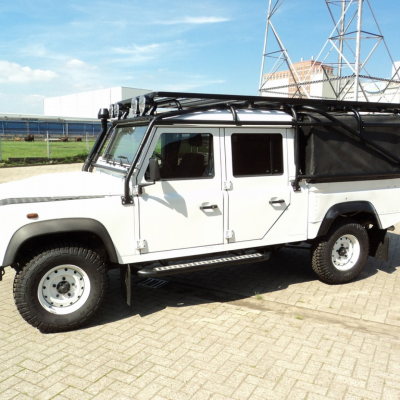 Defender 130 softtop met rolkooi en roofrack